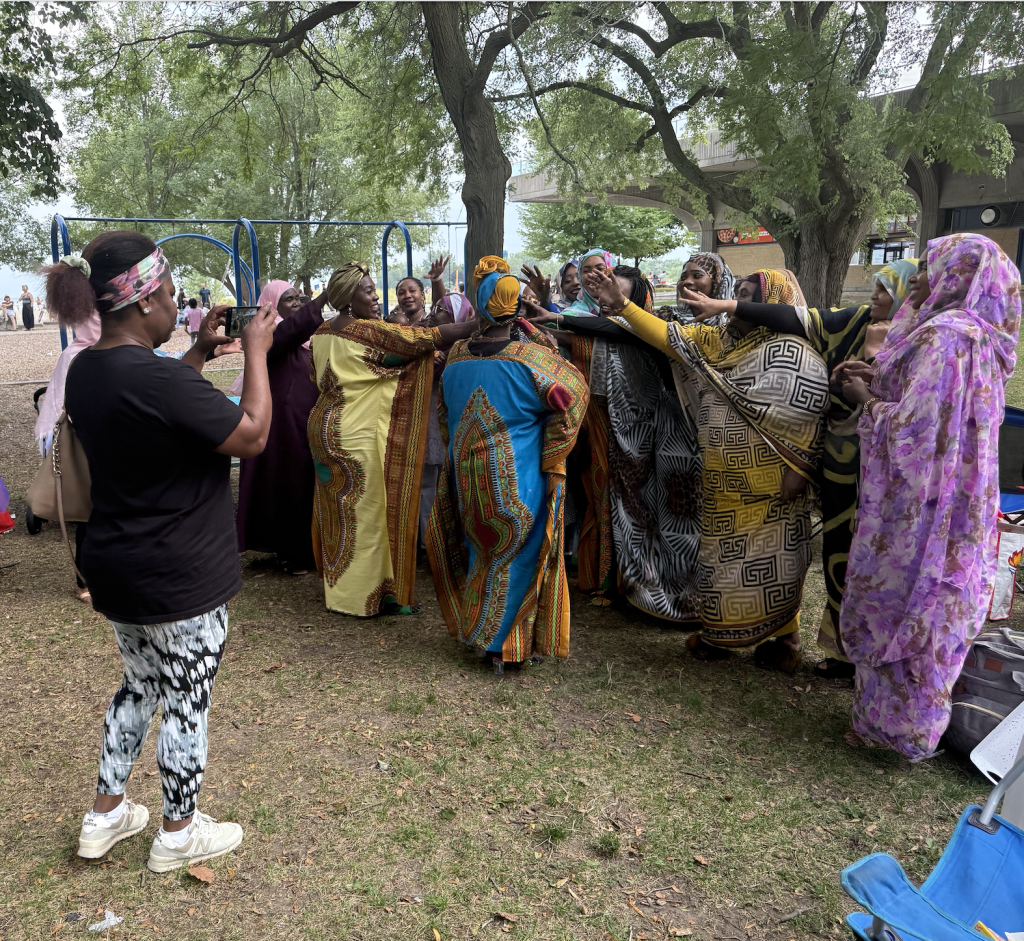 Women gathering together at ODWO’s Unity in Action community event at Woodbine Beach.